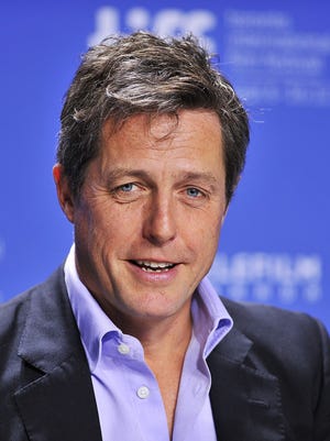 Hugh Grant speaks during the news conference for the film 'Cloud Atlas'during the 2012 Toronto International Film Festival in Canada.