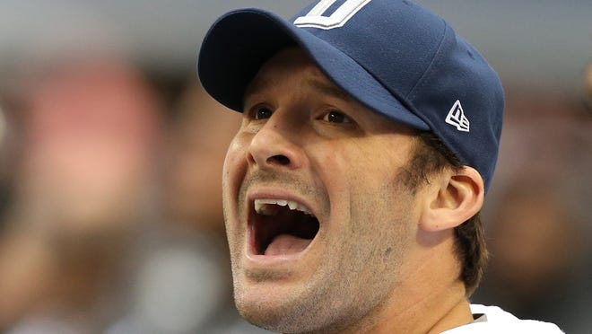 Dallas Cowboys quarterback Tony Romo (9) yells from the sidelines against the New Orleans Saints at Cowboys Stadium. The Saints beat the Cowboys 34-31 in overtime.