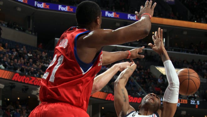 Memphis Grizzlies guard Wayne Ellington has his shot blocked by Philadelphia 76ers forward Thaddeus Young.