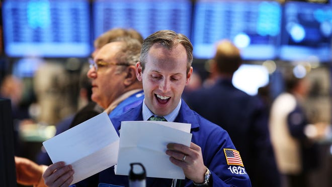 Traders work on the floor of the New York Stock Exchange on Jan. 2, 2013, as stocks rally.