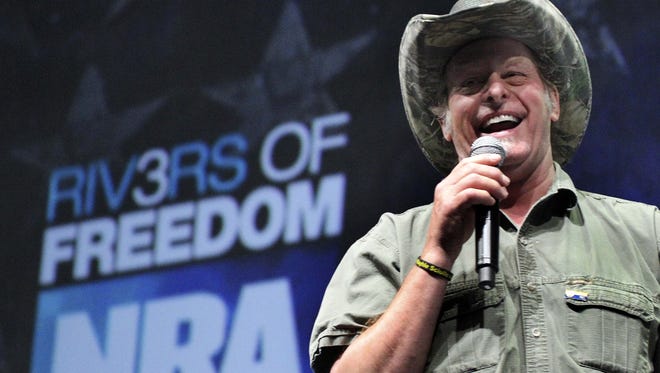 Musician and gun-rights activist Ted Nugent speaks at the National Rifle Association's convention in Pittsburgh in May 2011. Nugent has complained that gun-control activists don't blame cars for auto fatalities.