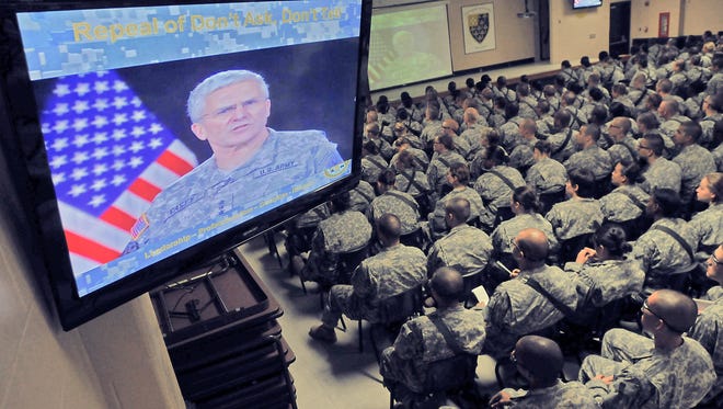 In an Aug. 22, 2011, photo, new recruits listen as a video talks about the "Don't Ask Don't Tell" policy at Fort Jackson in Columbia, S.C.