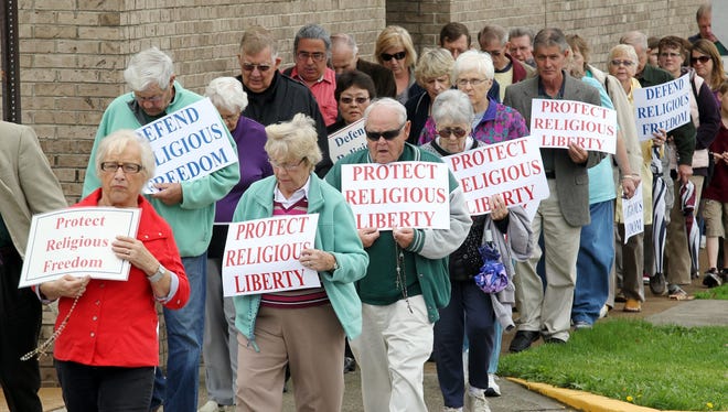 More than 100 people from the Belleville, Ill., Diocese marched on March 13, 2012, as part of a nationwide protest of the federal mandate that requires private health care plans to provide coverage of contraceptive and other items that go against the Catholic religion.