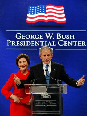 Former president George W. Bush and his wife, Laura, speak at the 2010 groundbreaking ceremony for his library at SMU.