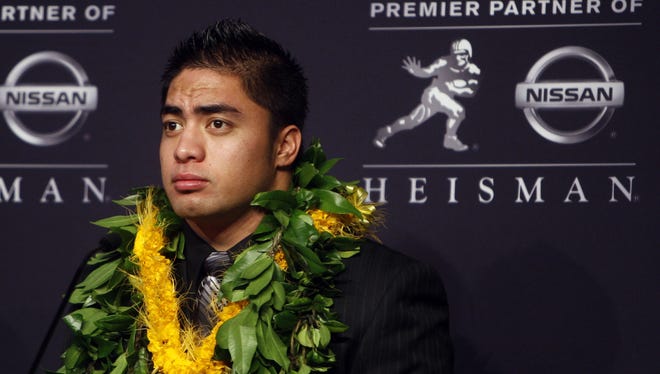 Manti Te'o, pictured Dec. 8 in New York City, is under scrutiny after news broke that his girlfriend did not exist.