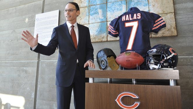 New Bears coach Marc Trestman poses for pictures at Halas Hall.