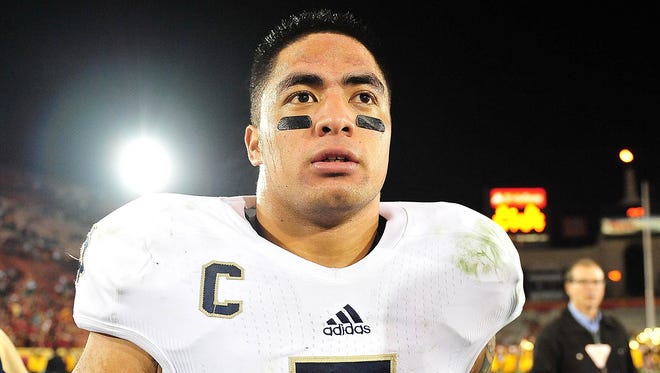 Notre Dame Manti Te'o walks off the field after the team's 22-13 victory against Southern California.