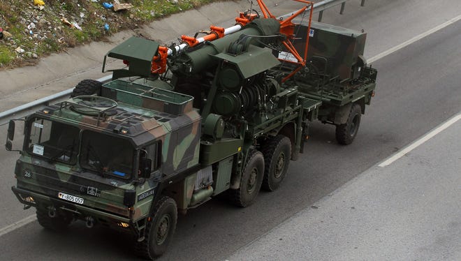 German military trucks carrying NATO's Patriot Missile Defense System to protect Turkey.