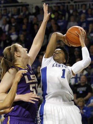 Kentucky's A'dia Mathies (1) shoots under pressure from LSU's Theresa Plaisance during the first half of an NCAA college basketball game at Memorial Coliseum in Lexington, Ky.
