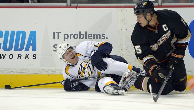 Nashville Predators right wing Patric Hornqvist screams in pain after getting tangled up along the boards with Anaheim's Ryan Getzlaf.