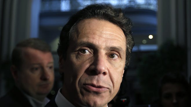 New York Gov. Andrew Cuomo talks to reporters on Tuesday, Oct. 23, 2012, in Albany, N.Y.