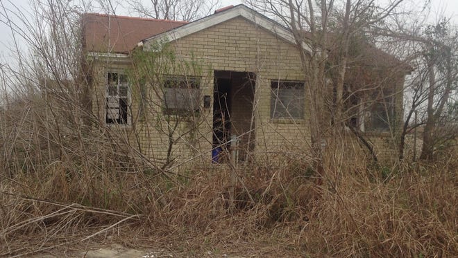 An abandoned home sits vacant in New Orleans' Lower Ninth Ward nearly eight years after Hurricane Katrina.