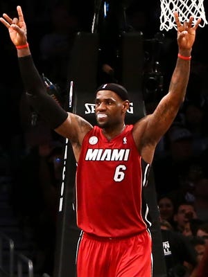 Miami Heat small forward LeBron James celebrates on the court against the Brooklyn Nets during the second half at Barclays Center. Miami won 105-85.