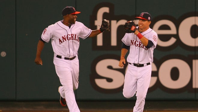 This photo of Torii Hunter and Mike Trout from Trout's major league debut in July 2011 is hanging in Trout's New Jersey basement.
