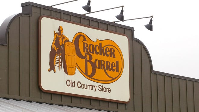A Cracker Barrel Old Country Store sign is visible atop one of its restaurant stores in Naperville, Ill.