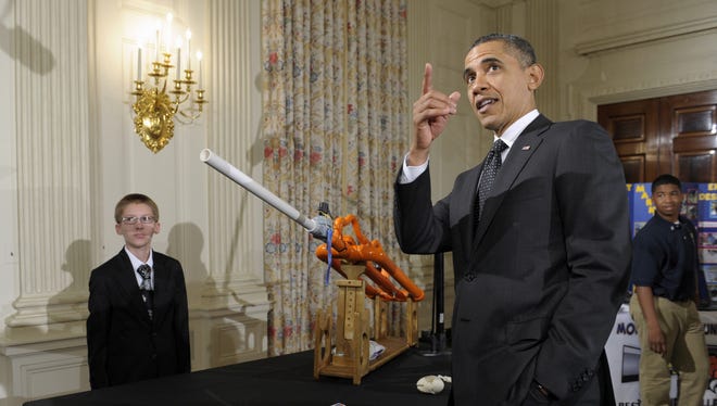 President Obama watches a marshmallow launched from a gun designed by Joey Hudy of Phoenix during the White House Science Fair last year. He has announced plans for a STEM Master Teacher Corps.