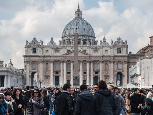 Pope Benedict faces crowds; Vatican faces confusion