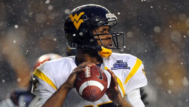 West Virginia quarterback Geno Smith threw for 42 touchdowns with six interceptions, completing 71.4% of his passes in West Virginia's 'Air Raid' shotgun spread offense.