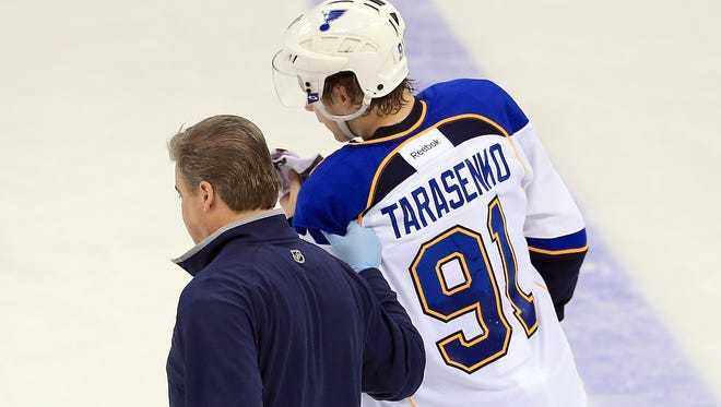 St. Louis Blues rookie Vladimir Tarasenko is helped off the ice after taking a hit against the Colorado Avalanche on Wednesday.