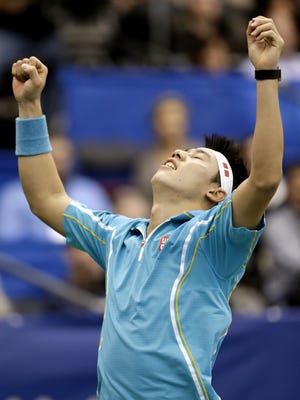 Kei Nishikori of Japan celebrates after defeating Feliciano Lopez of Spain in the final of the U.S. National Indoor Championships.
