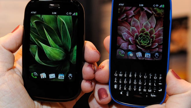 A Palm Pre Plus phone, left, and a Palm Pixi Plus are displayed at the International CTIA Wireless 2010 convention in Las Vegas. Both ran on webOS.
