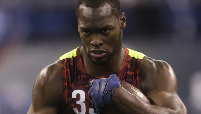 Louisiana State defensive lineman Barkevious Mingo runs a drill during the NFL football scouting combine in Indianapolis, Monday, Feb. 25, 2013.