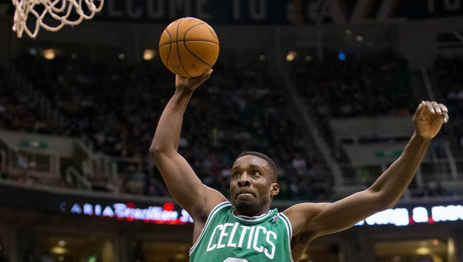Boston Celtics power forward Jeff Green (8) goes up for a dunk during the first half against the Utah Jazz at EnergySolutions Arena.
