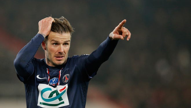David Beckham of PSG signals to a teammate during the French Cup match between Paris Saint-Germain FC and Marseille Olympic OM at Parc des Princes on Wednesday in Paris.