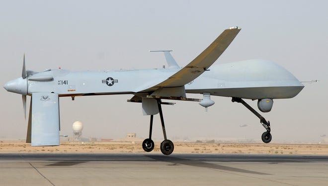 U.S. fighter jets escorting an unarmed Predator surveillance drone, similar to this one, over the Persian Gulf chased away an approaching Iranian warplane Thursday, the Pentagon said.