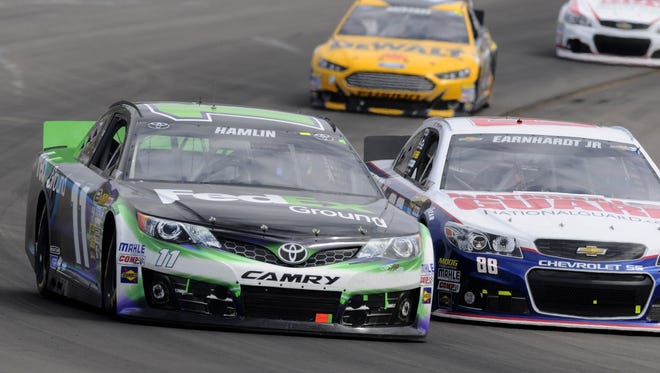 Denny Hamlin, left, criticized the lack of passing by the new Gen 6 after the Sprint Cup race at Phoenix on March 3.