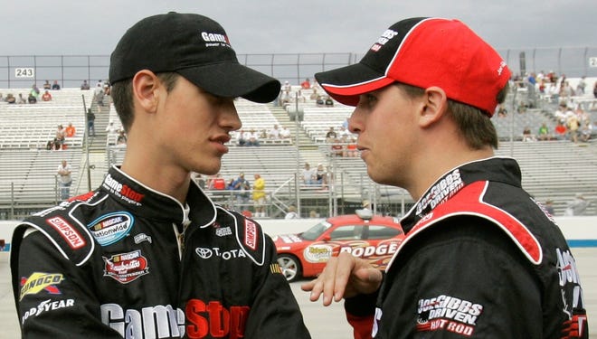 Joey Logano (left) and Denny Hamlin talk before a Nationwide Series race in 2008.