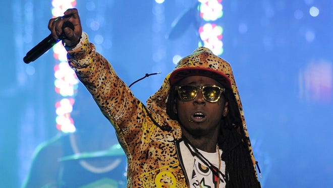 Lil Wayne performs in Los Angeles in this March 1, 2012, photo.