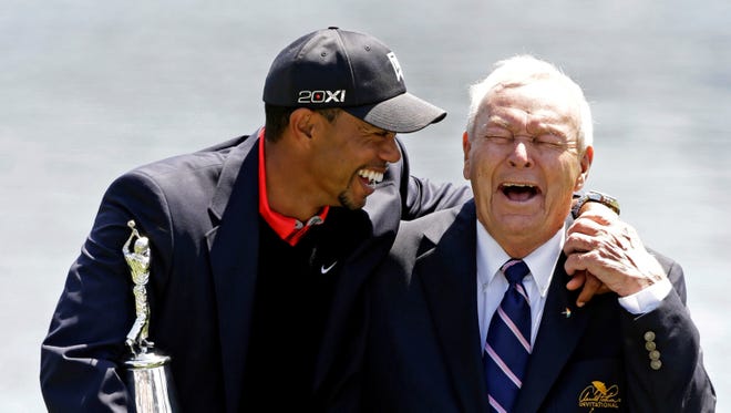 Tiger Woods shares a laugh with Arnold Palmer after winning at Bay Hill for the eighth time.