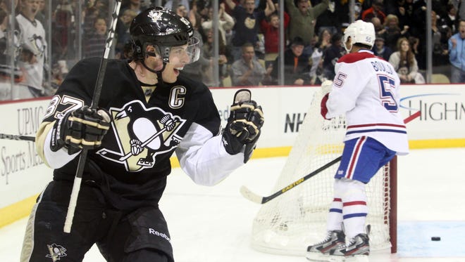 Pittsburgh Penguins center Sidney Crosby  celebrates his second-period goal, the lone score of the game.