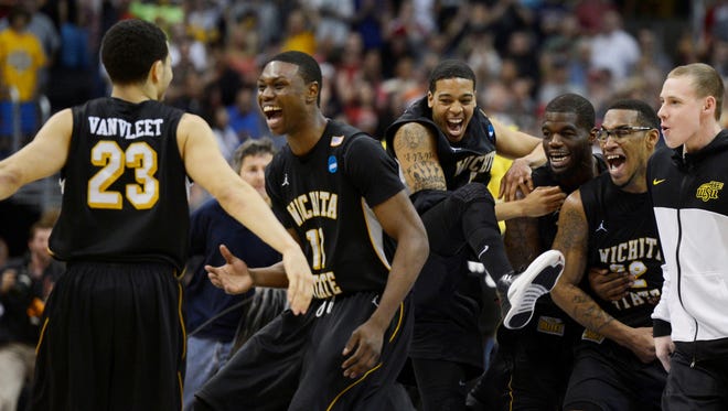 Wichita State forward Cleanthony Early (11) and  forward Carl Hall (22) and guard Fred Van Vleet (23) celebrate after winning the West Region final Saturday in Los Angeles. The Shockers are the first Missouri Valley Conference team to reach the Final Four since 1979.