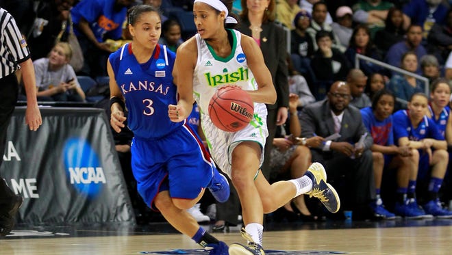 Notre Dame Fighting Irish guard Skylar Diggins (4) dribbles the ball as Kansas Jayhawks guard Angel Goodrich (3) defends in the second half during the semifinals of the Norfolk regional in the 2013 NCAA womens basketball tournament at Ted Constant Convocation Center. The Fighting Irish won 93-63.