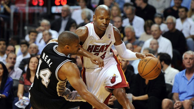 Heat guard Ray Allen drives through Spurs guard Gary Neal during the teams' November meeting.