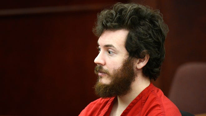 James Holmes, shown in a March 12 appearance at a hearing in Centenntial , Colo., has offered to plead guilty in exchange for life in prison and no death penalty.