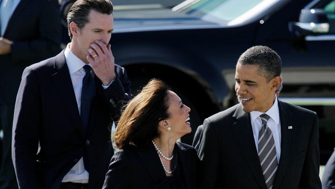 President Barack Obama walks with California Attorney General Kamala Harris, center, and  California Lt. Gov. Gavin Newsom.