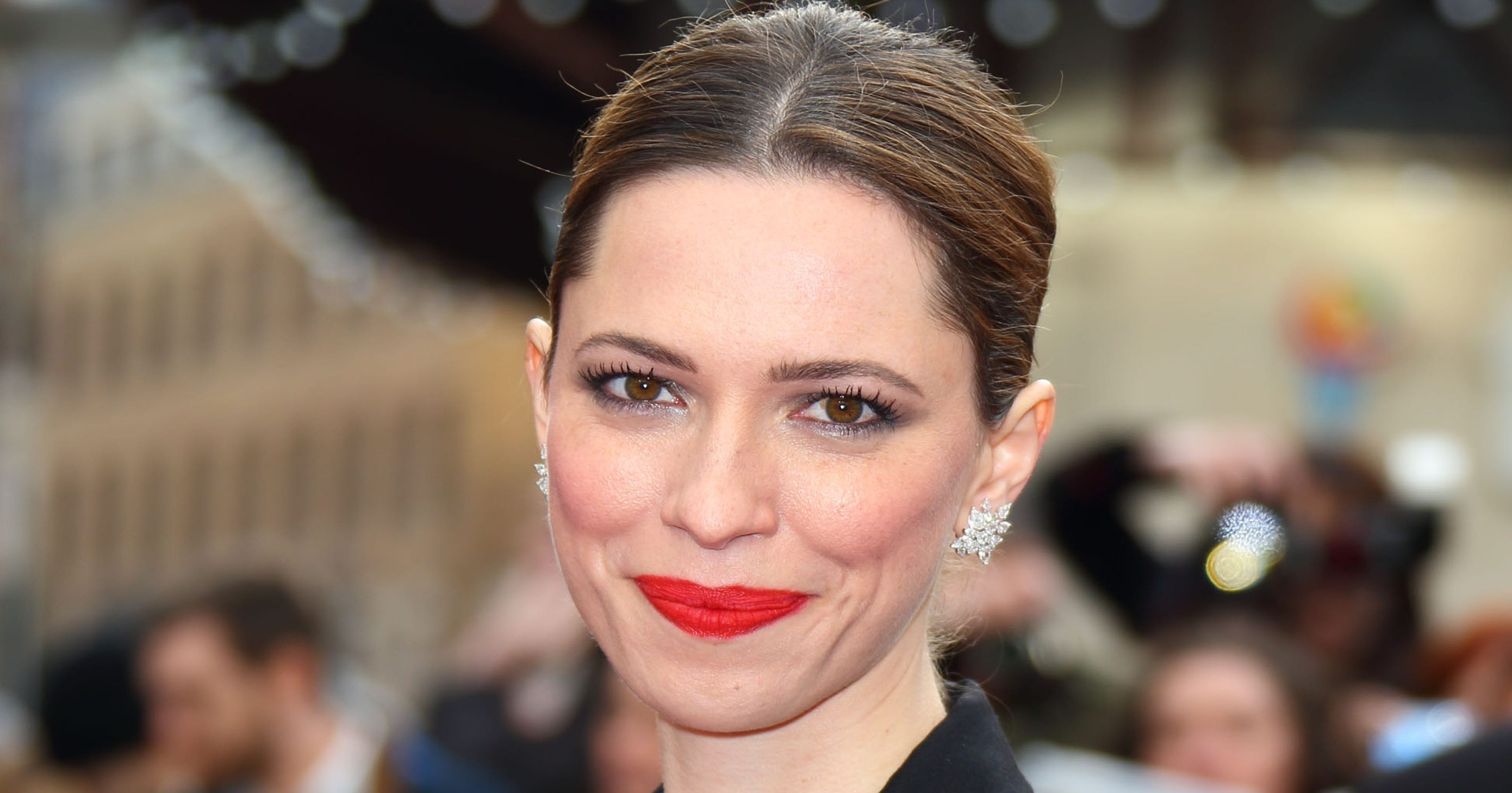 Rebecca Hall nearly jumps out of jumpsuit