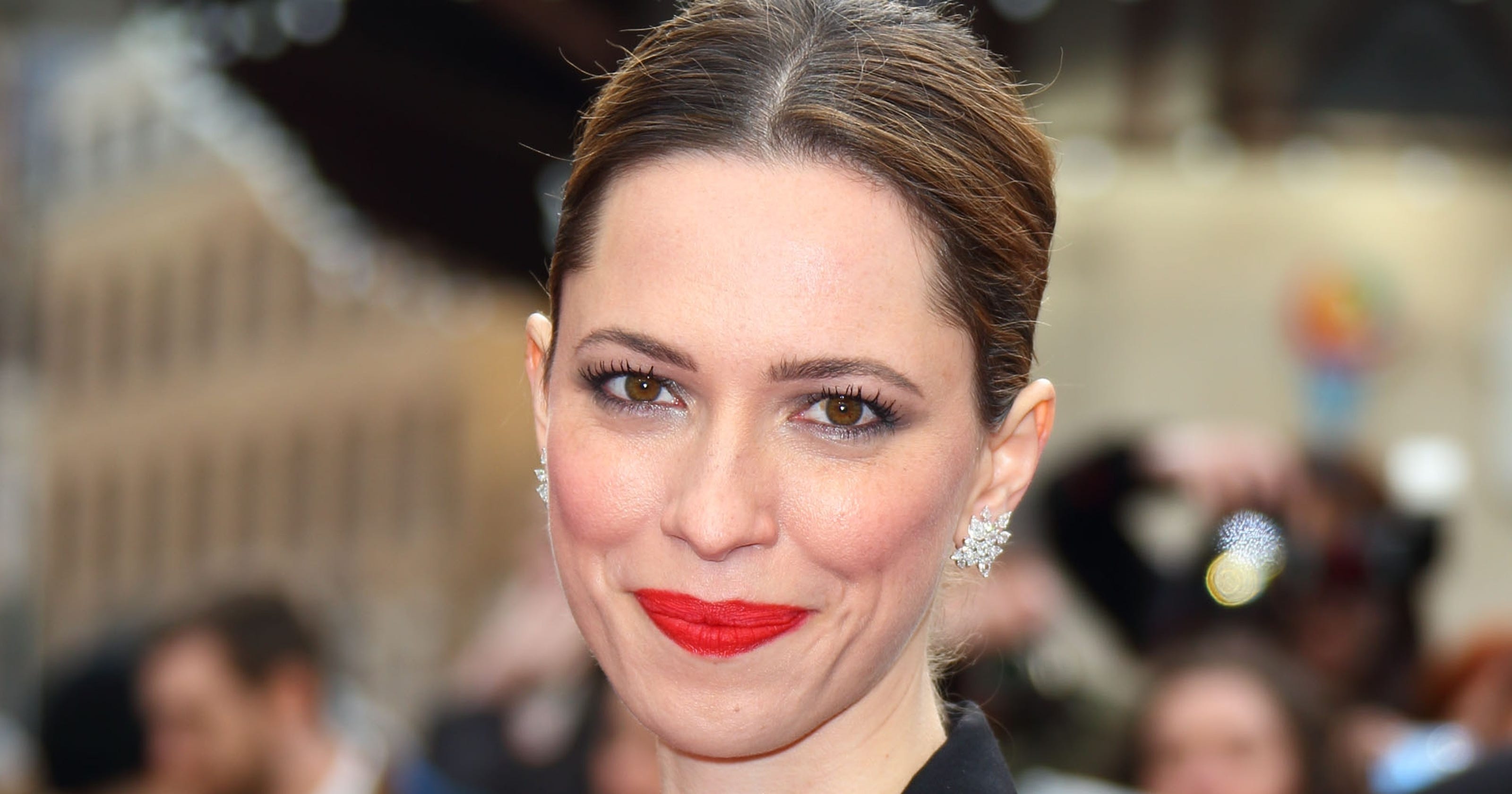 Rebecca Hall nearly jumps out of jumpsuit