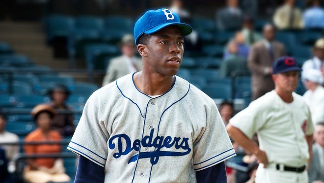 This film image released by Warner Bros. Pictures shows Chadwick Boseman as Jackie Robinson in a scene from "42."