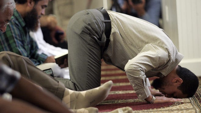 Praying at an Islamic center in August.