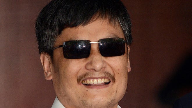 Chinese activist Chen Guangcheng arrives at Washington Square Village on the campus of New York University.