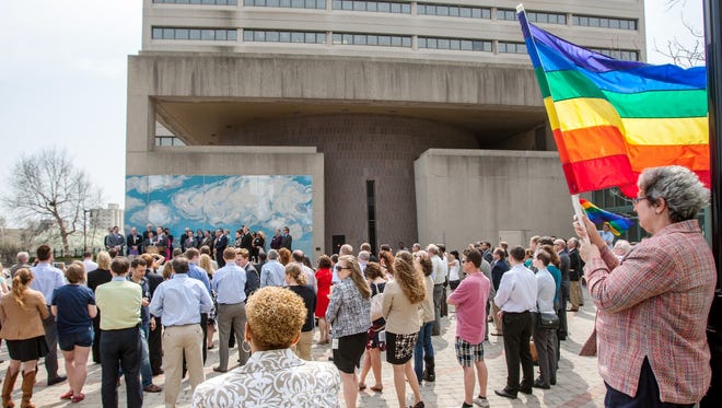 Supporters of same-sex marriage gather in Freedom Plaza in Wilmington, Del., April 11, 2013, for a news conference about the introduction of a bill that would legalize same-sex marriage in the state.