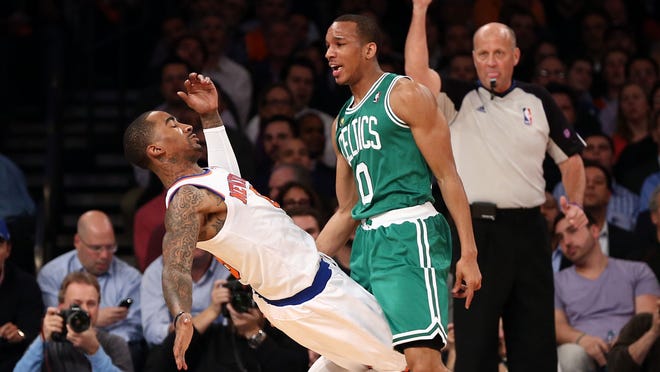 Celtics guard Avery Bradley bumps into Knicks guard J.R. Smith, knocking him over, during Game 2 Tuesday.