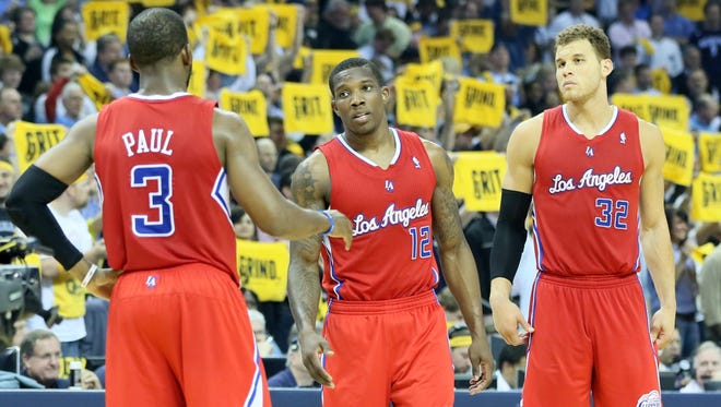 Clippers guards Chris Paul and Eric Bledsoe and forward Blake Griffin talk during Game 4 in Memphis.