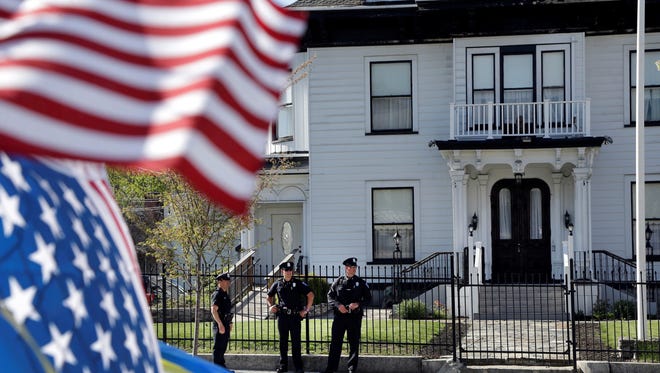 Police guard the Graham Putnam & Mahoney Funeral Parlors in Worcester, Mass., on Monday where Tamerlan Tsarnaev's body is being prepared for burial.