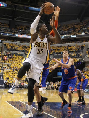 Indiana Pacers center Roy Hibbert (55) takes a shot against New York Knicks center Tyson Chandler (6)  and guard Pablo Prigioni (9) in game three of the second round of the 2013 NBA Playoffs at Bankers Life Fieldhouse.
