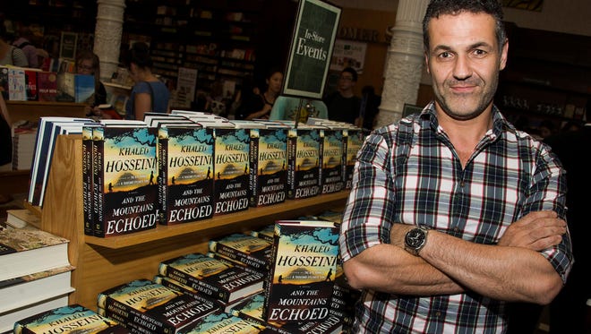 Khaled Hosseini, author of 'And the Mountains Echoed,' signs books at Barnes , Noble on May 21.